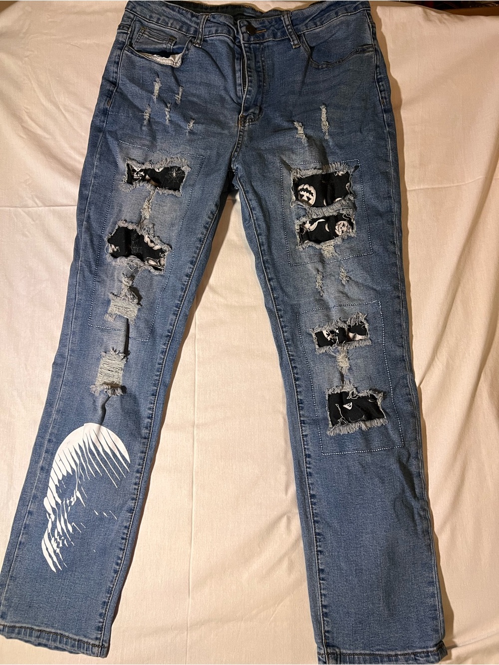 Blue Distressed Women's Jeans with skeleton Patch Detail